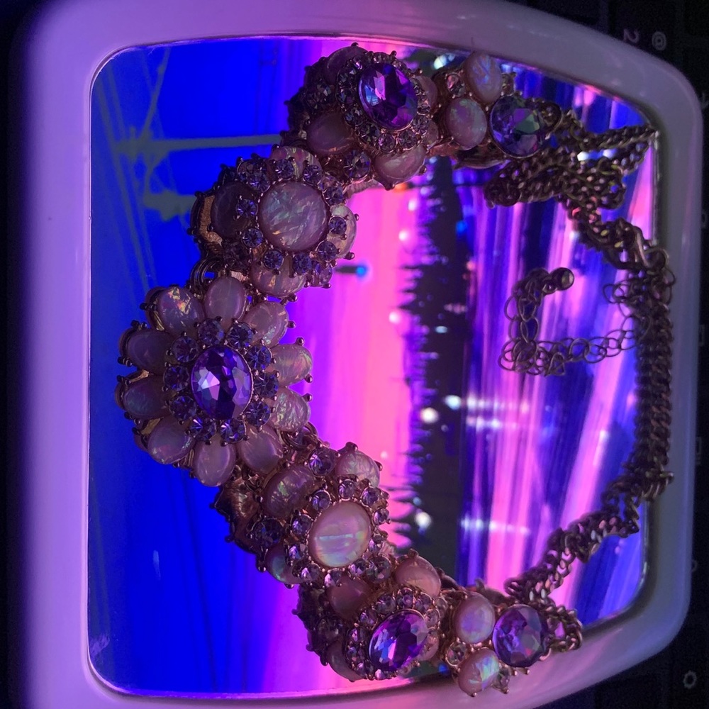 Holo necklace encrusted with jewels.